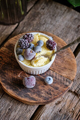 cottage cheese soufflé with berries. wooden background.