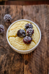 cottage cheese soufflé with berries. wooden background.