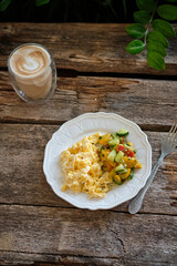 Scramble. Tomato and cucumber salad