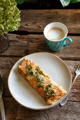 Omelette roll with cheese, tomatoes, parsley, sesame and green onions