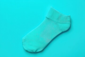 Aqua Sock on Teal Background.