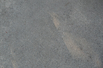 Gray asphalt texture. Surface of gray asphalt path with sun light.