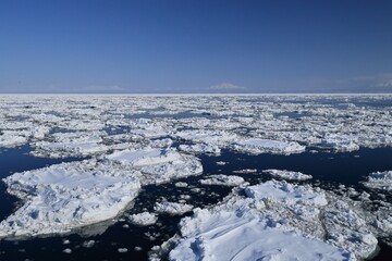 Shiretoko, ice floe with mountain range in Hokkaido, Japan,, Sea of Okhotsk © shuttered