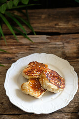 Yeast pancakes topped with honey