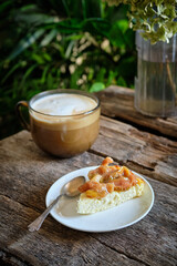 a piece of cheesecake with fig sauce. cottage cheese casserole.	
