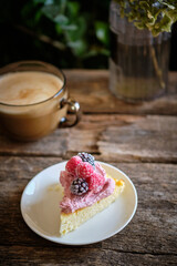 a piece of cheesecake with pink cottage cheese cream and berries. cottage cheese casserole.	
