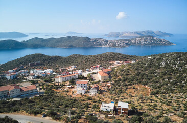 Obraz premium View of the area of the city of Kas in Turkey, located on the peninsula and the Greek island of Kastellorizo in the distance