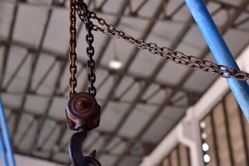 The load hangs on an old rusty iron hook, Crane Hook and Chain Link , Machine hook and chain