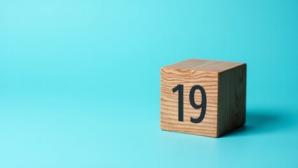 Number 19 March cube shape wood on blue background for father day countdown concept
