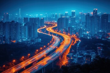 Obraz premium Elevated highway curves through illuminated city at night