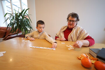 Grandmother and a grandson playing