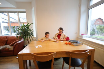 Grandmother and a grandson playing