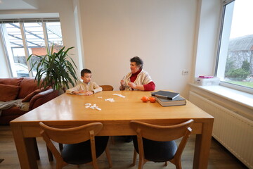 Grandmother and a grandson playing