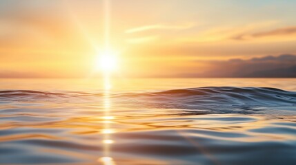 Fototapeta premium Sunset over calm ocean waves reflecting vibrant colors of the sky in a serene coastal landscape during twilight hours