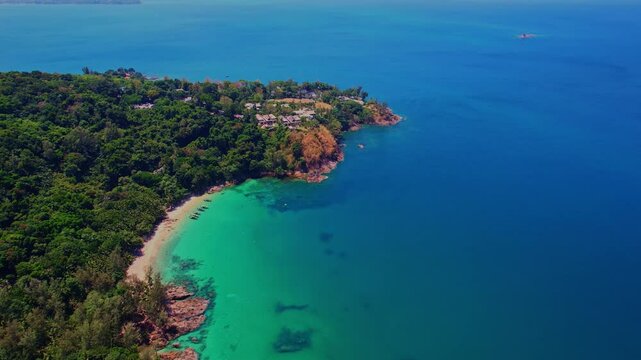 Aerial view turquoise water with tropical beach Phuket with Thai longtail boat, Travel concept in Thailand.