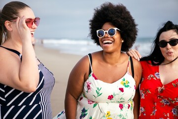 Diverse confident plus size women at the beach. Happy curvy women at the beach. Female friends...