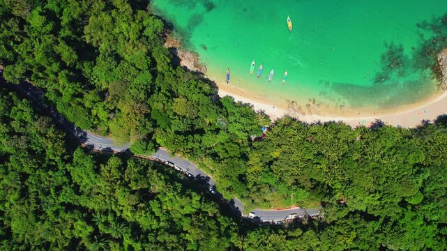 Aerial view turquoise water with tropical beach with Thai longtail boat Phuket, Travel landscape of Thailand.