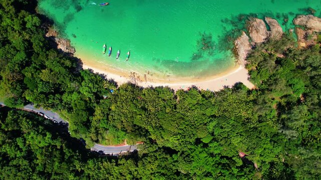 Aerial view turquoise water, tropical beach Phuket with longtail boat, Travel in Thailand.