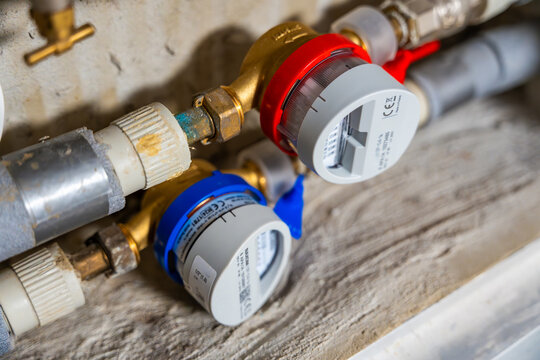 Smart water and heat meters with remote data transmission installed in a European utility system. The concept represents modern energy efficiency and digital infrastructure development