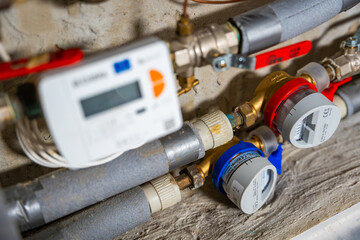 Smart water and heat meters with remote data transmission installed in a European utility system. The concept represents modern energy efficiency and digital infrastructure development