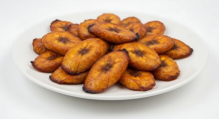 A Ghanaian kelewele dish, showcasing perfectly spiced and fried plantains on a white plate.