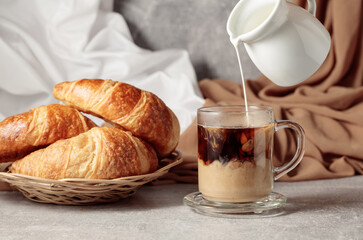 Croissants and coffee with cream.