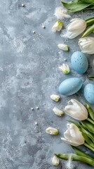 Easter celebration blue eggs and tulips on gray stone table