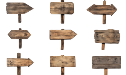 collection of wooden directional signs arranged in a grid each sign varies in shape and size. with some displaying arrows and others being blank. suggesting a rustic aesthetic suitable for guiding or