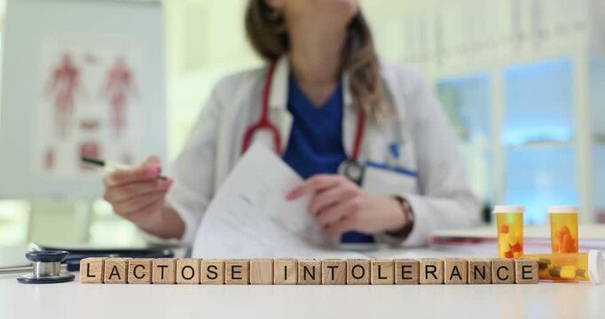 A healthcare professional discusses lactose intolerance and medication options in a clinical setting