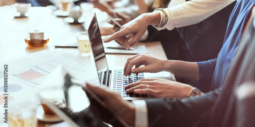 Poster Group of professionals collaborating at a desk with laptops and documents. Hands pointing at screens, teamwork in a business meeting, team working together. Business people in a boardroom meeting.