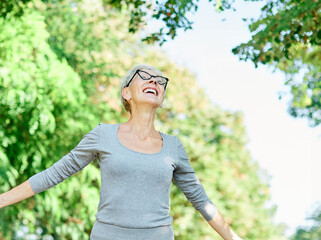 woman senior happy retirement elderly dreaming relaxation meditation nature active imagination daydreaming  harmony freedom carefree wellbeing