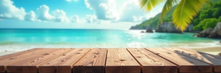 Fototapeta premium Empty wooden table on tropical beach; blurred ocean, sky, clouds, travel, sun, background