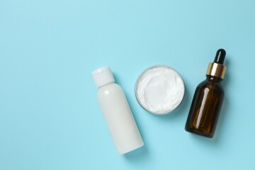 Natural cosmetic products a blue background, top view
