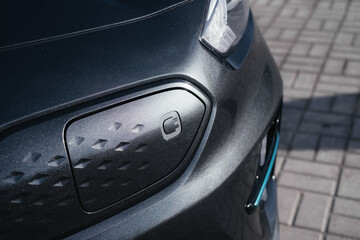 A stylish and modern electric car.  fast charging port. Exterior details.