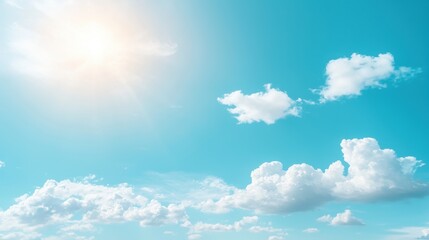 Soft Wispy Clouds with Bright Sunlight Over a Clear Blue Sky Background