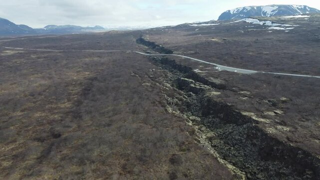 aerial footage of ground cracks at tectonic plate boundaries in iceland (thingvellir)