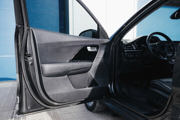 Salon of a modern and youth electric car. Fast charging port.  Interior details.