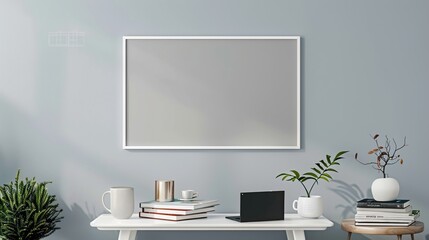 A white rectangular frame above a side table in a living room, surrounded by a cup, a laptop, and a small stack of books.  HD 8K white mockup wallpaper Photographic Image
