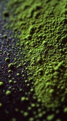 Vibrant green moringa powder on a dark surface
