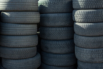 Closeup of a stack of used but well maintained car tires