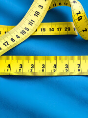 Measuring tapes of tailor with indicators in form of centimeters.