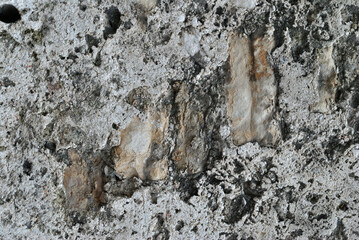 Old Rough Textured Stone Wall in Close Up