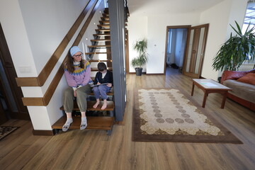 Mother and a child boy playing indoors 