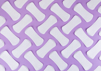 Sanitary pads, Sanitary napkins on violet background. Menstruation, Feminine hygiene