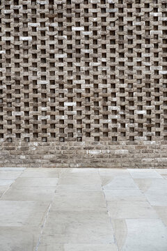 Detailed brick structure with contemporary architectural pattern.