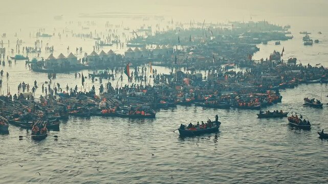 Aerial view of Huge crowd at Triveni Sangam in Prayagraj, India during Maha Kumbh. Kumbh Mela is the most important event, where millions of devotees, including Sadhu take a sacred holy dip in Ganga.