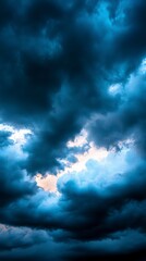 Fototapeta premium Dramatic Blue Clouds Before the Stormy Weather Creates a Heavily Dark Toned Skyline Atmosphere