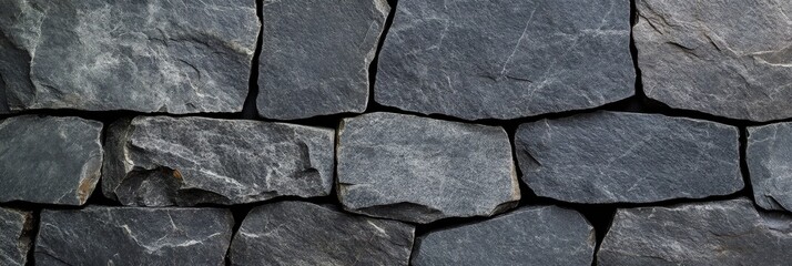 Obraz premium A closeup view of a stone wall with closely arranged bricks