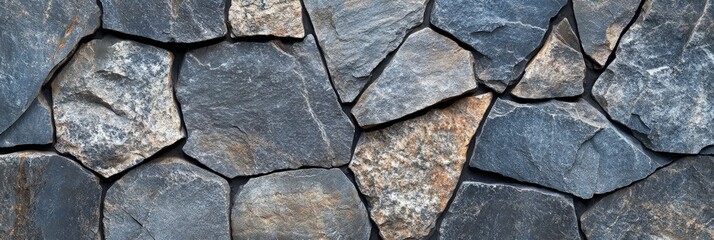 Obraz premium A closeup view of a stone wall with closely arranged bricks