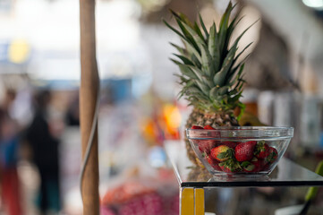 Fresh fruits displayed at a market in Essaouira, Morocco during a sunny day